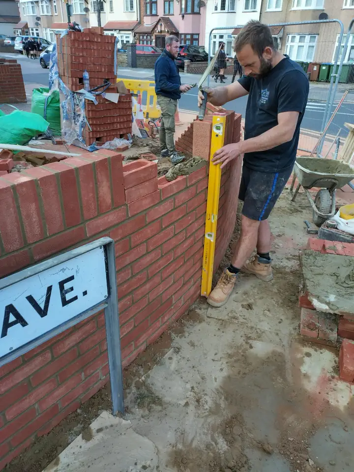 Ricky Kayley laying a new front garden wall